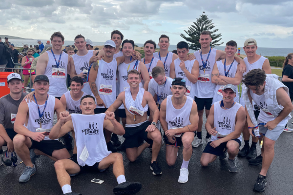 Group of young men in singlets after running event