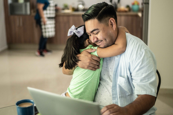 Child hugging a man