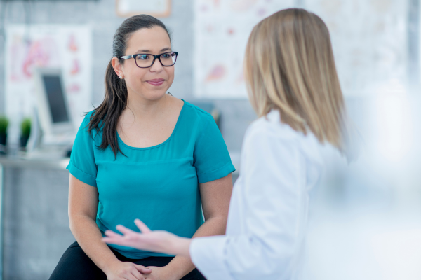 A doctor speaking with her patient