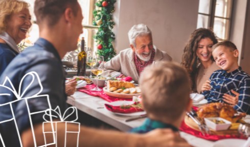 A family gathers around the table at Christmas