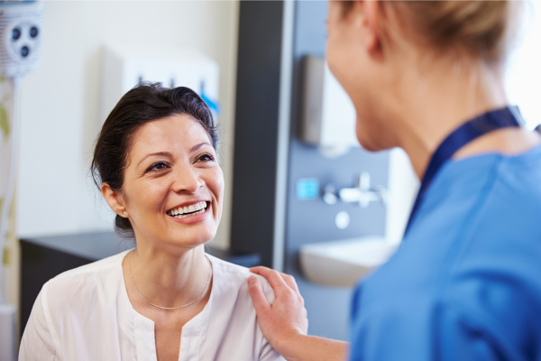 A nurse talking with her patient